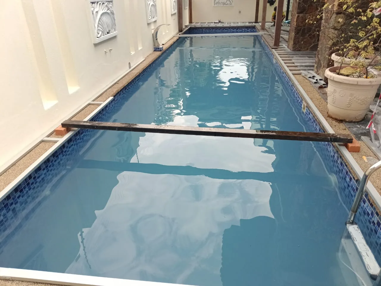 Clear long residential pool after cleaning