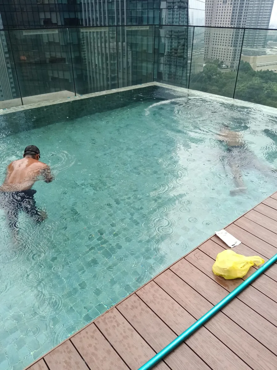 Rooftop pool cleaning at a high-rise property